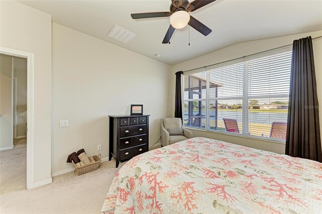 bedroom featuring visible vents, ceiling fan, baseboards, carpet floors, and vaulted ceiling