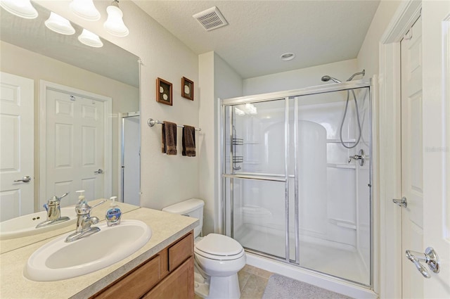 bathroom featuring toilet, tile patterned flooring, visible vents, and a shower stall