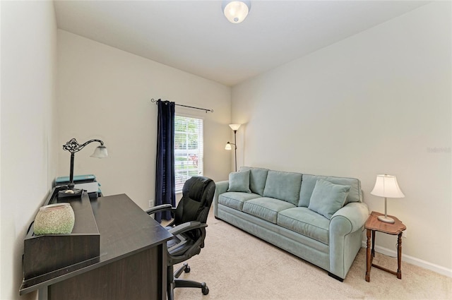 carpeted office space featuring baseboards