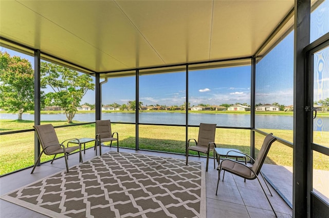 sunroom / solarium with a water view
