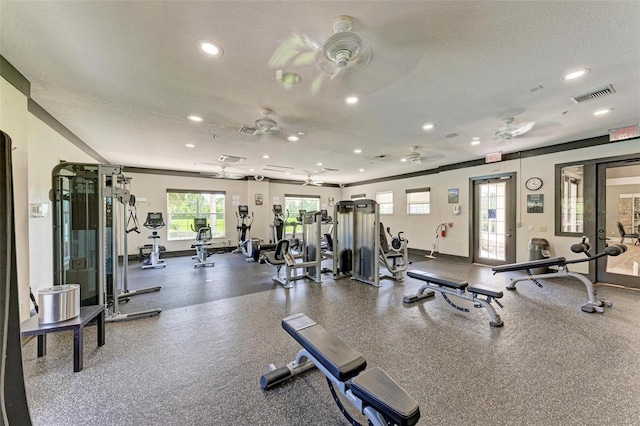 exercise room featuring recessed lighting, ceiling fan, visible vents, baseboards, and a textured ceiling