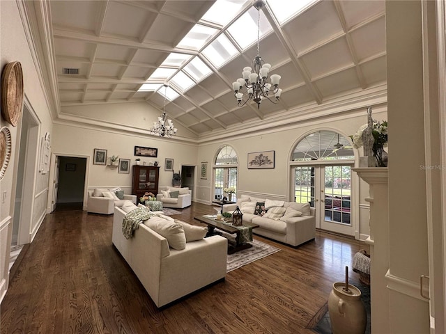 708 E Main St, Wauchula, FL 33873 - living area featuring coffered ceiling, dark wood finished floors, lofted ceiling, and a notable chandelier