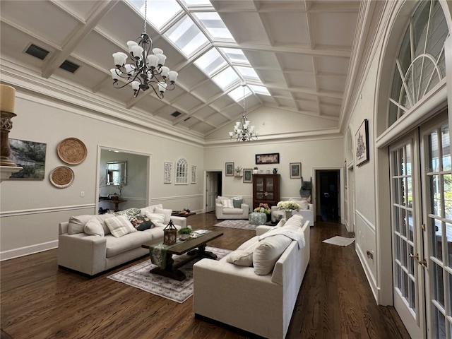 708 E Main St, Wauchula, FL 33873 - living area featuring french doors, dark wood-type flooring, visible vents, a notable chandelier, and baseboards