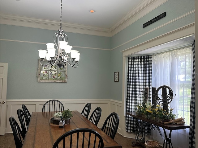 708 E Main St, Wauchula, FL 33873 - dining room with a wainscoted wall, a wealth of natural light, a chandelier, and dark wood-style flooring