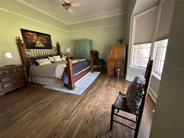 708 E Main St, Wauchula, FL 33873 - bedroom with ornamental molding, baseboards, and wood finished floors