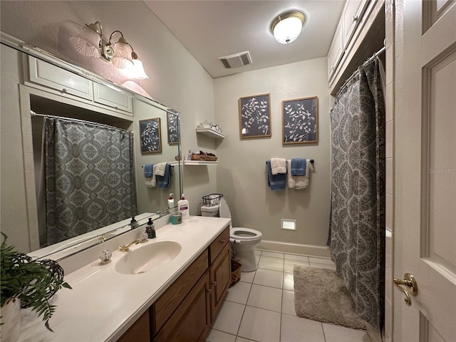 708 E Main St, Wauchula, FL 33873 - bathroom with toilet, baseboards, visible vents, tile patterned floors, and vanity
