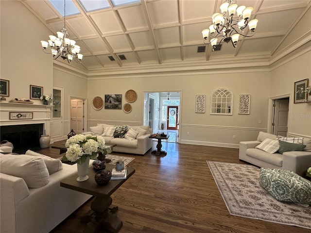 708 E Main St, Wauchula, FL 33873 - living area with an inviting chandelier, coffered ceiling, and a towering ceiling