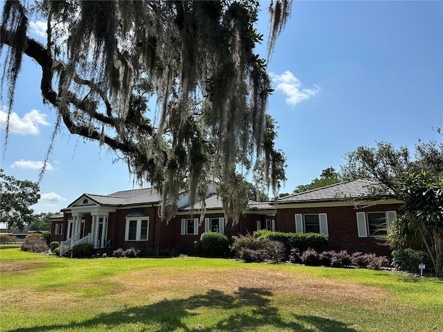708 E Main St, Wauchula, FL 33873 - single story home with a front lawn and brick siding