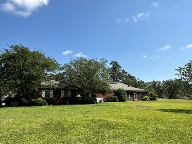 708 E Main St, Wauchula, FL 33873 - view of front of house with a front lawn