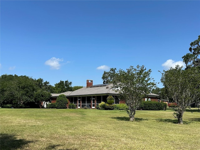 708 E Main St, Wauchula, FL 33873 - view of front of house with a chimney and a front yard