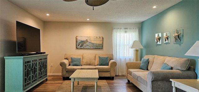 living area featuring ceiling fan, recessed lighting, baseboards, and wood finished floors