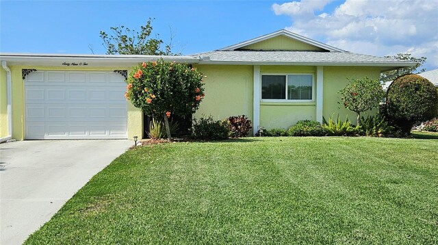 ranch-style home with stucco siding, roof with shingles, a front lawn, and driveway