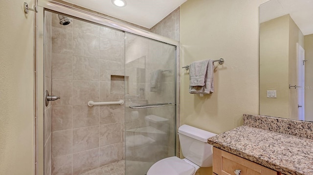 2259 Pueblo Ln Unit V38, Sarasota, FL 34231 - bathroom with toilet, a stall shower, vanity, and recessed lighting