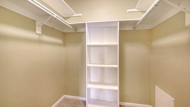 2259 Pueblo Ln Unit V38, Sarasota, FL 34231 - spacious closet featuring light tile patterned floors