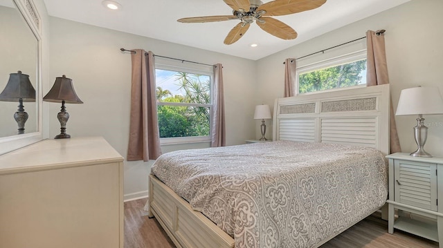 2259 Pueblo Ln Unit V38, Sarasota, FL 34231 - bedroom with wood finished floors, multiple windows, baseboards, and recessed lighting