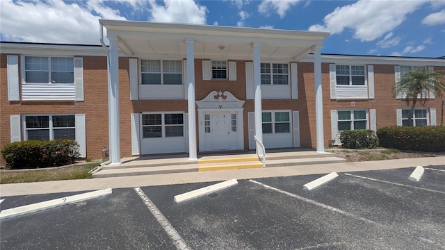 4158 Tamiami Trl Unit V1, Port Charlotte, FL 33952 - view of building exterior featuring uncovered parking