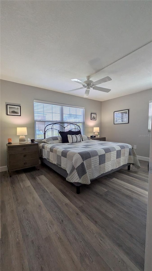 4158 Tamiami Trl Unit V1, Port Charlotte, FL 33952 - bedroom featuring dark wood-style floors, ceiling fan, and baseboards