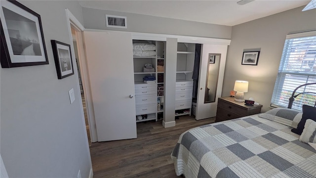 4158 Tamiami Trl Unit V1, Port Charlotte, FL 33952 - bedroom with visible vents, dark wood finished floors, and a closet