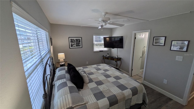 4158 Tamiami Trl Unit V1, Port Charlotte, FL 33952 - bedroom with wood finished floors, a ceiling fan, and baseboards
