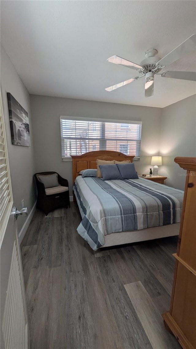 4158 Tamiami Trl Unit V1, Port Charlotte, FL 33952 - bedroom with wood finished floors, a ceiling fan, baseboards, and multiple windows