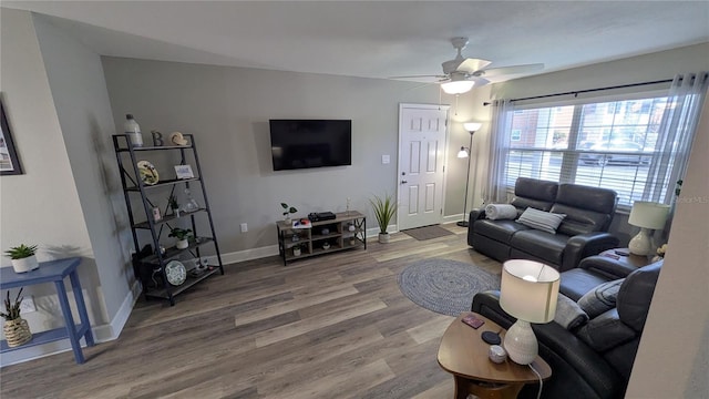 4158 Tamiami Trl Unit V1, Port Charlotte, FL 33952 - living area with wood finished floors, a ceiling fan, and baseboards