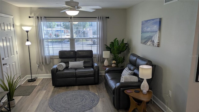 4158 Tamiami Trl Unit V1, Port Charlotte, FL 33952 - living room featuring a ceiling fan, visible vents, wood finished floors, and baseboards