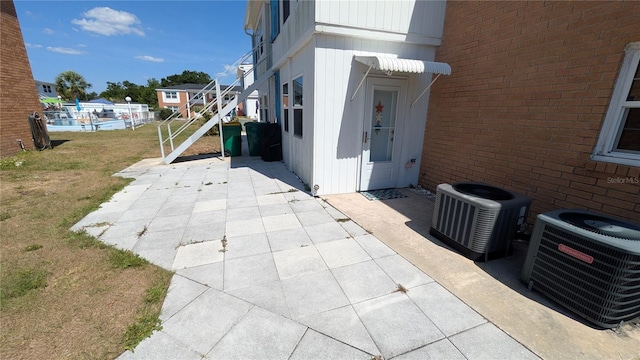 4158 Tamiami Trl Unit V1, Port Charlotte, FL 33952 - view of patio / terrace featuring central AC