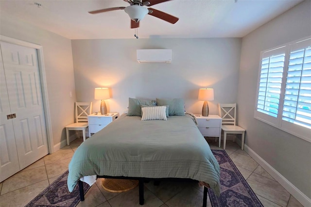 bedroom featuring baseboards, ceiling fan, and an AC wall unit