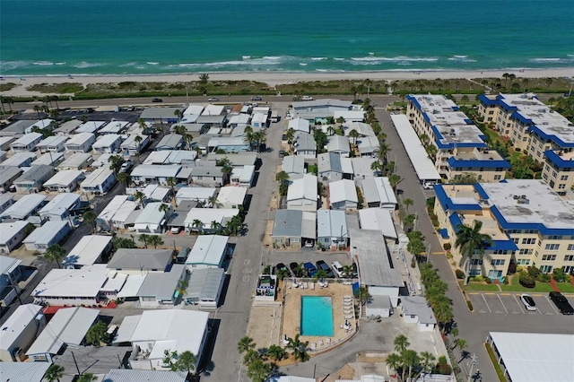 drone / aerial view with a water view and a view of the beach