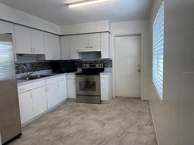 5014 22nd St W, Bradenton, FL 34207 - kitchen featuring a sink, stainless steel appliances, white cabinetry, under cabinet range hood, and tasteful backsplash