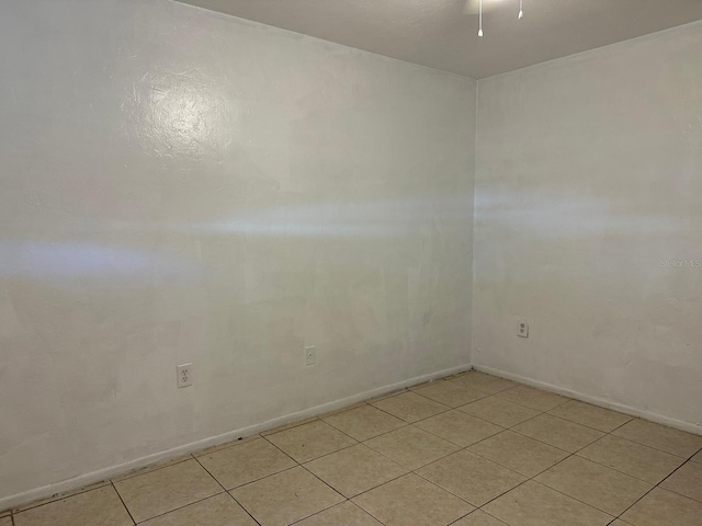 5014 22nd St W, Bradenton, FL 34207 - spare room featuring light tile patterned flooring and baseboards