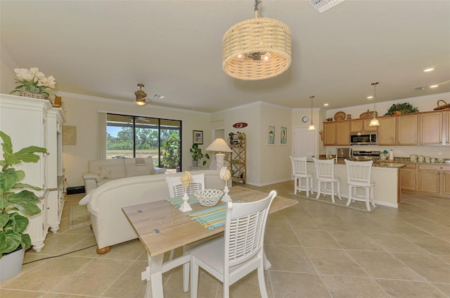 12315 Canavese Ln, Venice, FL 34293 - dining room featuring light tile patterned floors, ornamental molding, and recessed lighting