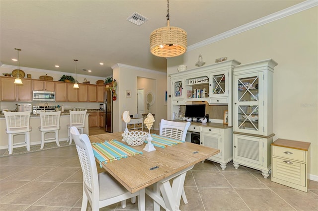 12315 Canavese Ln, Venice, FL 34293 - dining room with ornamental molding, light tile patterned floors, recessed lighting, and baseboards
