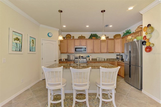12315 Canavese Ln, Venice, FL 34293 - kitchen with appliances with stainless steel finishes, a center island with sink, a sink, ornamental molding, and a breakfast bar area