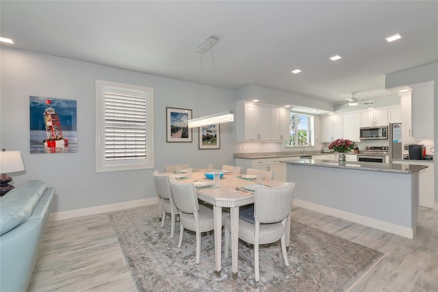dining room with baseboards, recessed lighting, light wood finished floors, and ceiling fan