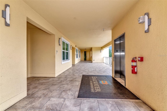 hallway featuring elevator