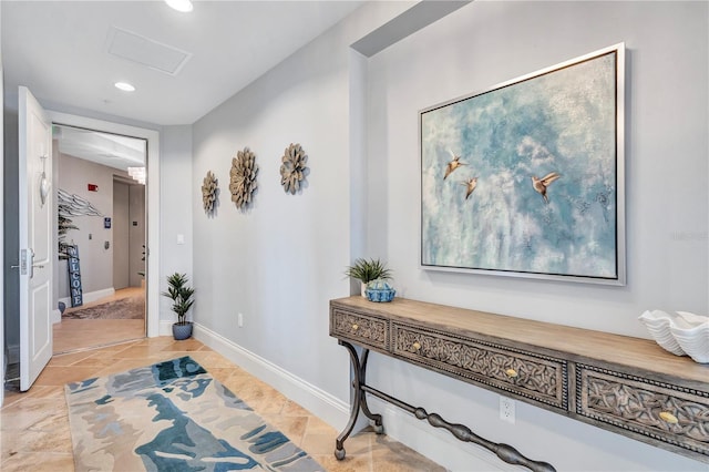 130 Riviera Dunes Way Unit 502, Palmetto, FL 34221 - hallway with attic access, recessed lighting, baseboards, light tile patterned floors, and visible vents