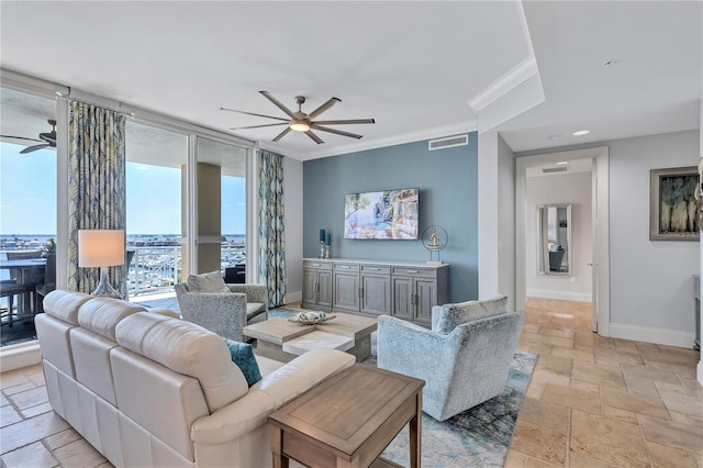 130 Riviera Dunes Way Unit 502, Palmetto, FL 34221 - living area featuring visible vents, baseboards, ceiling fan, and stone tile flooring