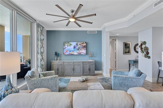 130 Riviera Dunes Way Unit 502, Palmetto, FL 34221 - living area with ceiling fan, visible vents, ornamental molding, and baseboards