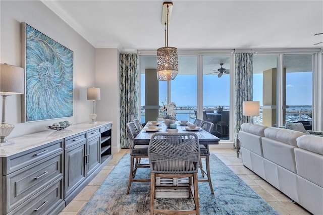 130 Riviera Dunes Way Unit 502, Palmetto, FL 34221 - dining area featuring light tile patterned floors, ornamental molding, and a ceiling fan