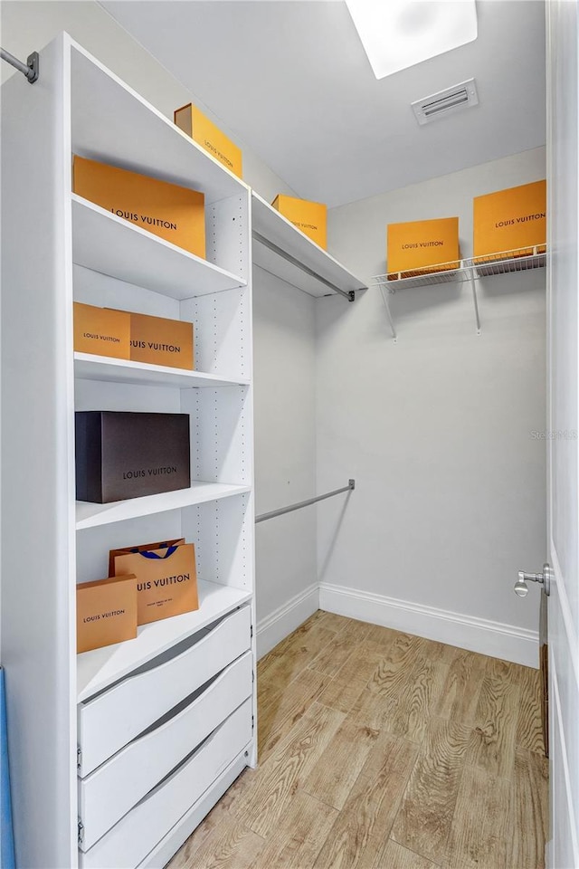 130 Riviera Dunes Way Unit 502, Palmetto, FL 34221 - walk in closet featuring visible vents and light wood-style flooring