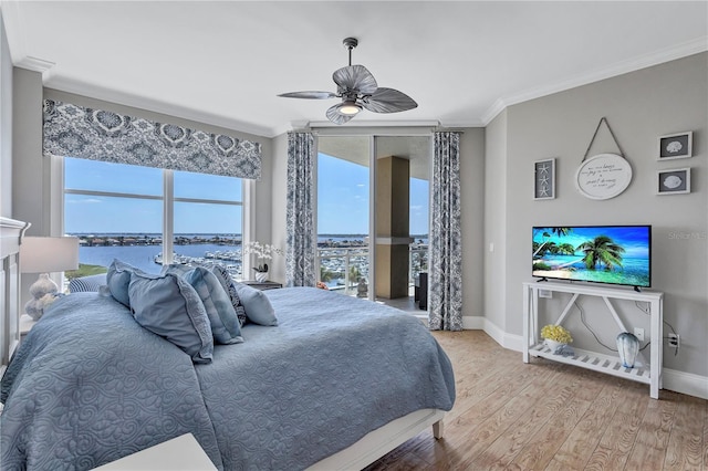 130 Riviera Dunes Way Unit 502, Palmetto, FL 34221 - bedroom with a ceiling fan, baseboards, ornamental molding, and wood finished floors