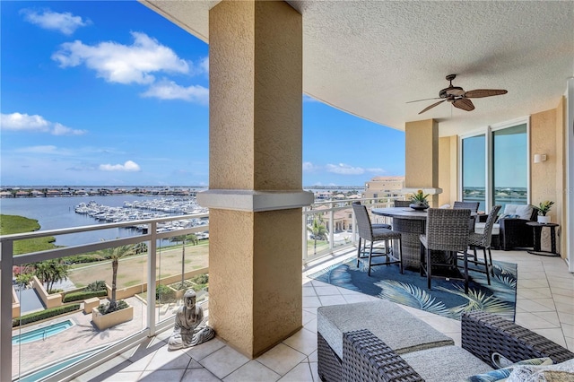 130 Riviera Dunes Way Unit 502, Palmetto, FL 34221 - view of patio featuring a ceiling fan, a water view, and a balcony