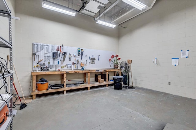 130 Riviera Dunes Way Unit 502, Palmetto, FL 34221 - garage with concrete block wall and a workshop area