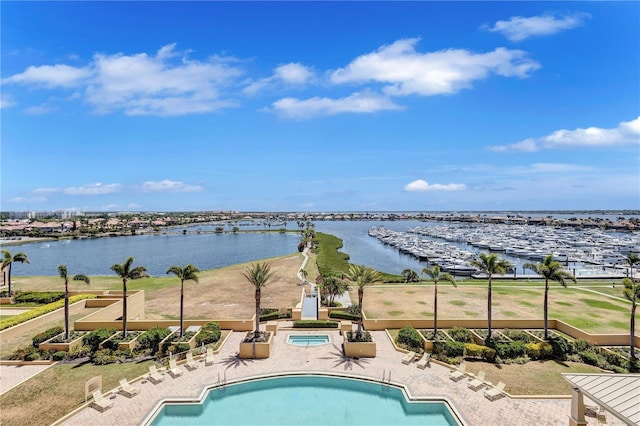 130 Riviera Dunes Way Unit 502, Palmetto, FL 34221 - community pool with a patio, a water view, and a hot tub