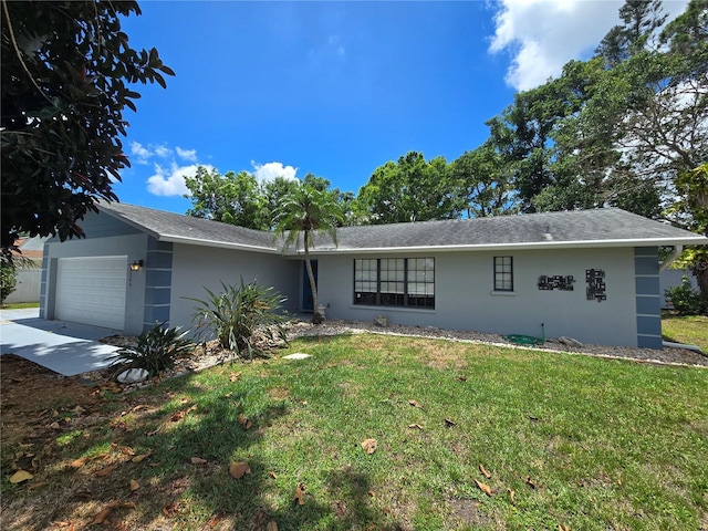 2204 34th St W, Bradenton, FL 34205 - ranch-style home featuring stucco siding, a garage, and a front lawn