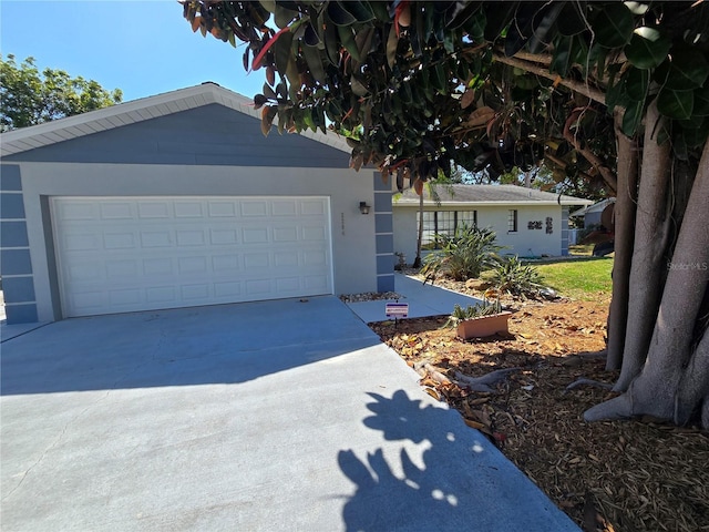 2204 34th St W, Bradenton, FL 34205 - ranch-style home with concrete driveway and an attached garage