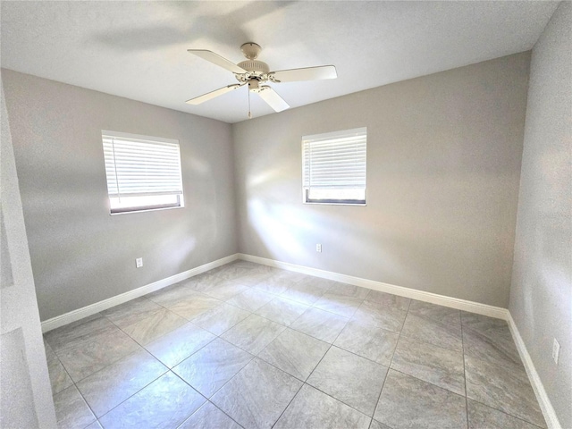 2204 34th St W, Bradenton, FL 34205 - spare room with baseboards and a ceiling fan