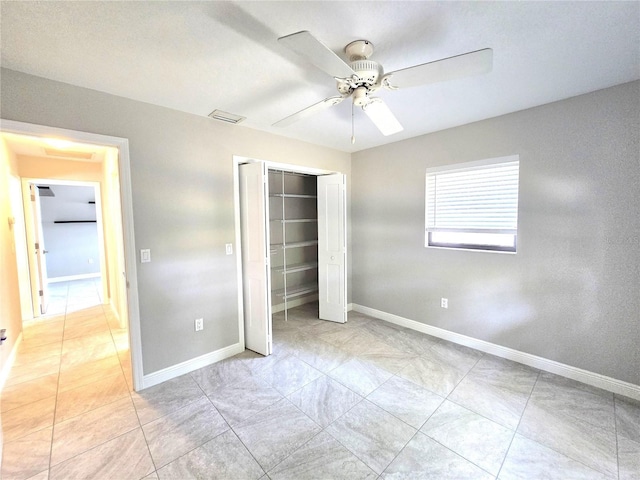 2204 34th St W, Bradenton, FL 34205 - unfurnished bedroom with a closet, baseboards, and a ceiling fan