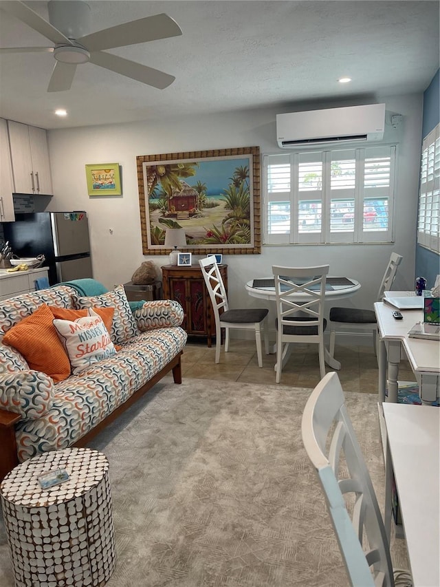living room with recessed lighting, a ceiling fan, and a wall mounted AC
